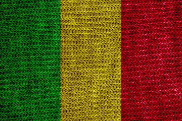 Flag of Republic of Mali on a textured background. Concept collage.