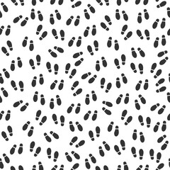 Black and White Seamless Pattern of Simple Boot Footprints