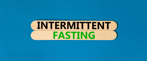 Intermittent fasting symbol. Concept words Intermittent fasting on beautiful wooden stick....