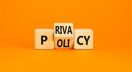 Privacy policy symbol. Concept words Privacy policy on wooden block on a beautiful orange table...