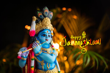 Janmashtami poster design, beautiful sculpture of  Lord Krishna with Happy Janmashtami greeting letter