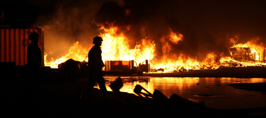 Ukraine war, Russian military attack on civilian buildings, bombed out building set on fire from...