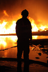Ukraine war, Russian military attack on civilian buildings, bombed out building set on fire from...