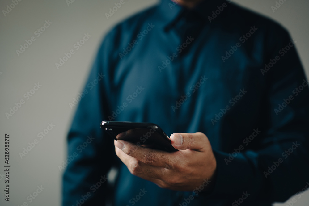 Poster man using smart phone for calls, social media, mobile application online