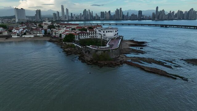 Aerial video of red buildings on the sea shore in San Felipe, Panama City