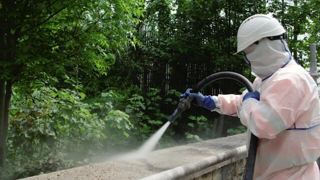 View of a shotcreting process with cement-sand mortar on the street