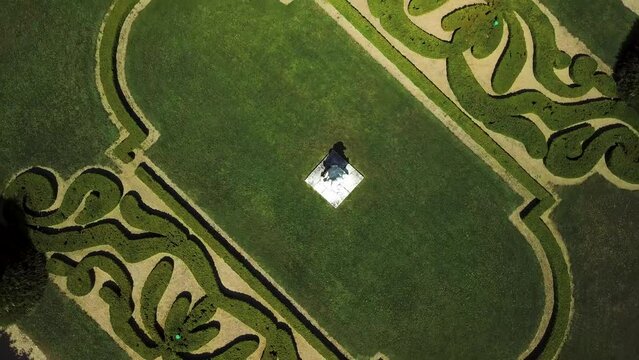 Aerial top view video of a statue and green decorative lawn next to Rodin Museum, Paris, France