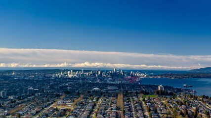 View of downtown Vancouver, British Columbia, with the Burrard Inlet in the foreground