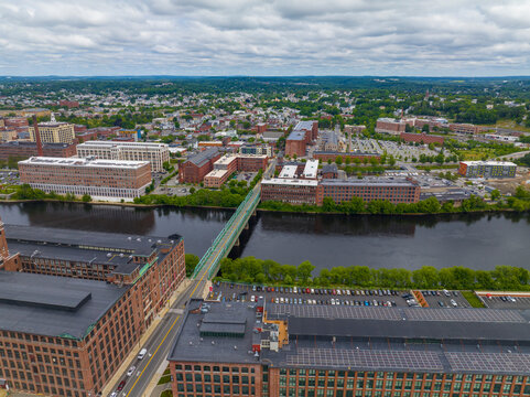 Duck Mill and Kunhardt Mill aerial view with Duck Bridge over Merrimack River in downtown Lawrence, Massachusetts MA, USA. The historic building was built in 1910 and now is abandoned. 