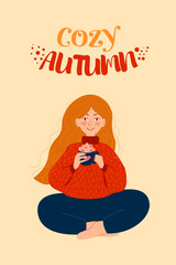 Red-haired girl drinks autumn coffee. Cozy autumn.