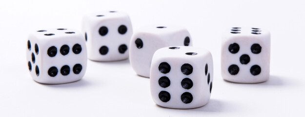 White game dice on a white background. Selective focus.