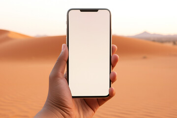 Mockup concept of a hand holding a modern smartphone with a white screen with a desert in the background. Generative AI