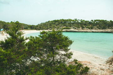 Fototapeta na wymiar Beautiful beach with turquoise water on the island of Mallorca, Spain