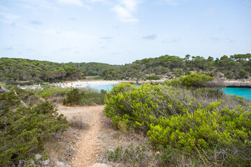 Beautiful sunset beach landscape, exotic tropical island nature, blue sea water, ocean waves, colorful red yellow sky, summer holidays vacation in Mallorca, Spain