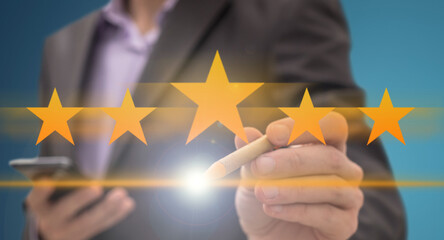 Increase rating, evaluation and classification concept. Businessman draw five yellow star to increase rating of his company. 