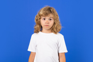 Portrait of funny child, isolated studio background.