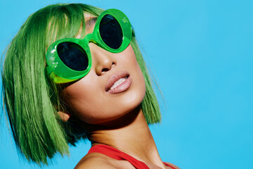 Woman portrait attractive smile trendy summer sunglasses wig swimsuit fun beauty fashion