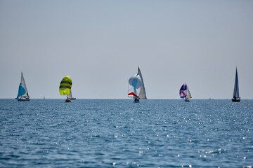 Sailing yacht regatta. Many sailing yachts in a row. sailing yachts under gennaker, speaker, genoa