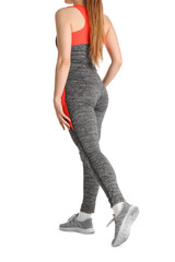 Young woman in sportswear on white background
