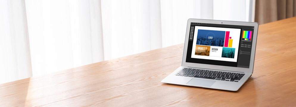 Graphic designer software for modern design of web page and commercial ads showing on the computer screen