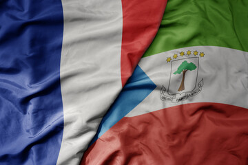 Fototapeta premium big waving realistic national colorful flag of france and national flag of equatorial guinea .