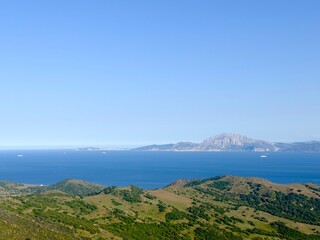 View from the Mirador del Estrecho viewpoint between Tarifa and Algeciras in Andalusia across the Strait of Gibraltar to Morocco with the Jbel Musa mountain and Ceuta, Spain