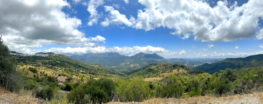 view over the hilly Andalusian landscape with the mountain village of Gaucin, Paraje Natural Los Reales de Sierra Bermeja, Estepona, Andalusia, Malaga, Spain