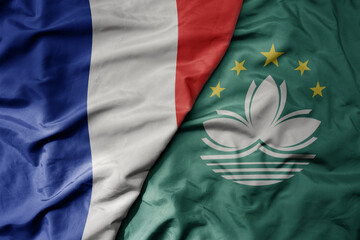 Obraz premium big waving realistic national colorful flag of france and national flag of Macau .