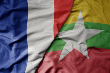 big waving realistic national colorful flag of france and national flag of myanmar .