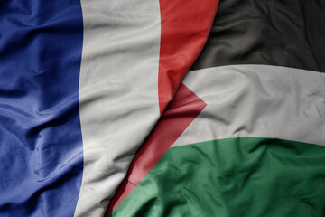 big waving realistic national colorful flag of france and national flag of palestine .