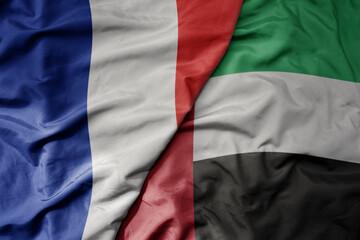 big waving realistic national colorful flag of france and national flag of united arab emirates .