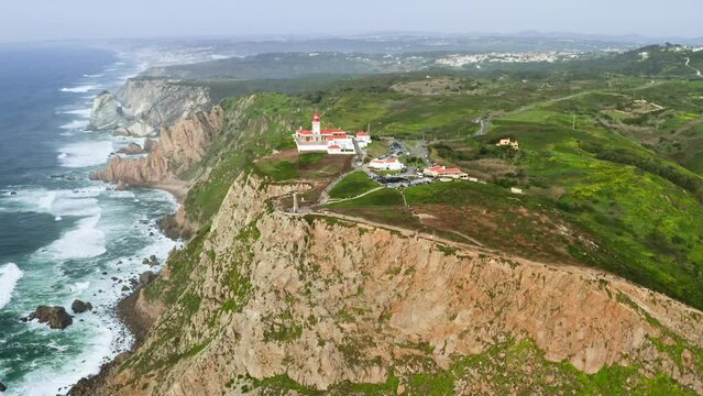 Cabo da Roca, Portugal. Cliffs and rocks on the Atlantic ocean coast in Sintra in a beautiful summer day, the most westerly point of the European mainland