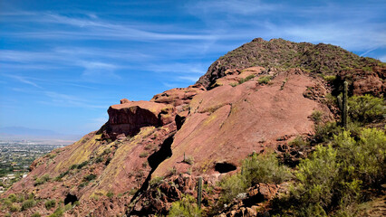 Red Rock Majesty: Dominating Peaks in the Desert Landscape Overlooking Arizona City Below