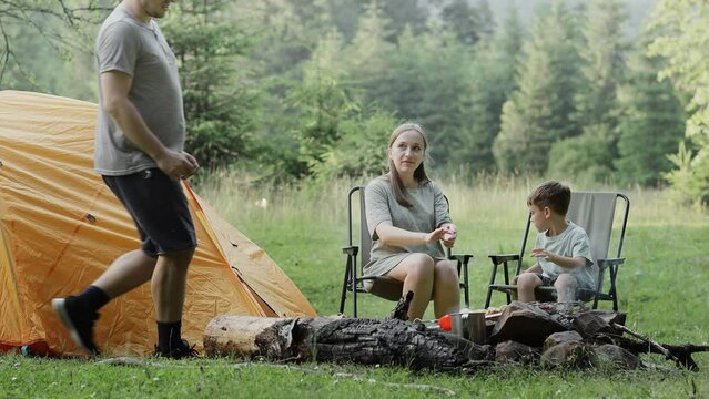 Mother and son are itching their hands from mosquito bites