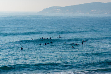 surfers waiting for a wave