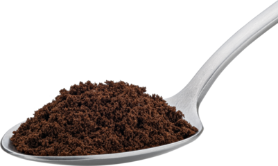 Ground coffee beans in spoon isolated, full depth of field