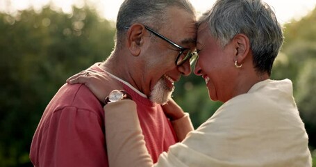 Senior couple, love and forehead touch in garden for hug, care and quality time together. Happy face of elderly man, woman and romance in retirement, loyalty in marriage and trust of freedom at park