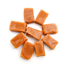 Caramel candies isolated on white background