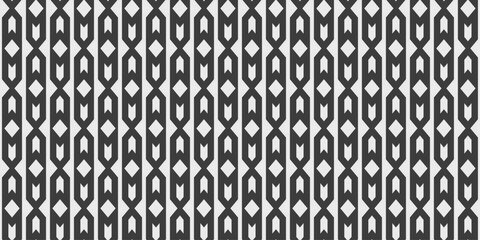 Black columns with rhombuses and chevrons inside. Design for textile, fabric, clothing, ornament, background, wrapping.