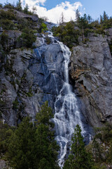 Fototapeta na wymiar Waterfall near Fireplace Creek and Merced River in Yosemite National Park in May of 2023 