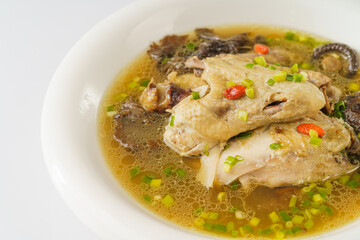 Special Chinese food stewed chicken with mushrooms on retro dark background