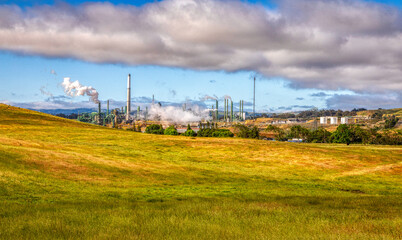 Fototapeta na wymiar Oil refinery plant over the hill.
