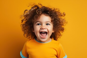 A happy toddler smiling. Isolated on a yellow orange plain background. Generative AI.