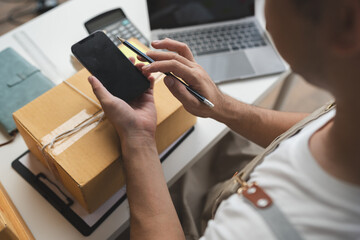 small business owner starting Asian Freelance Entrepreneur Using Phone to Check Customer Orders Online at Home Startup Small Business Entrepreneur SME Freelance Online Work from Home Business
