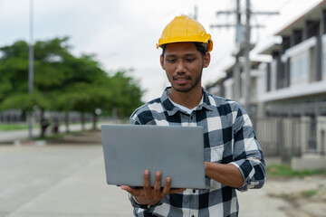 Engineer working at construction site View and check data from a laptop to check locations, routes,...
