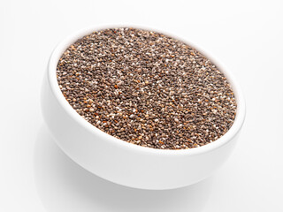 Chia seeds in a deep white bowl on a white background. Isolate. Incline. Close-up. Selective focus.