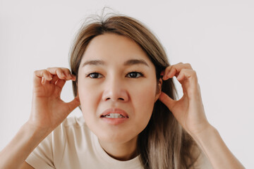 Asian man make funny teasing face for humor isolated on white.