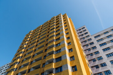 Fototapeta premium Yellow multistory apartment house in the city of Berlin