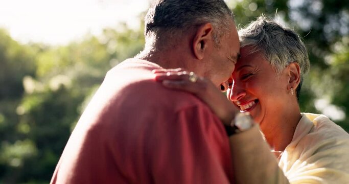 Happy couple, senior and forehead touch in park for love, care and relax quality time together. Face, elderly man and romantic woman smile for retirement, loyalty in marriage and trust in a garden