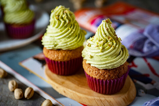Sweet dessert: pistachio cupcakes. Cupcakes with pistachio cream for breakfast. Close-up